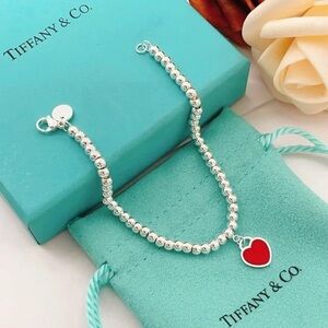 Tiffany & Co. Silver Bracelet with Red Heart Charm